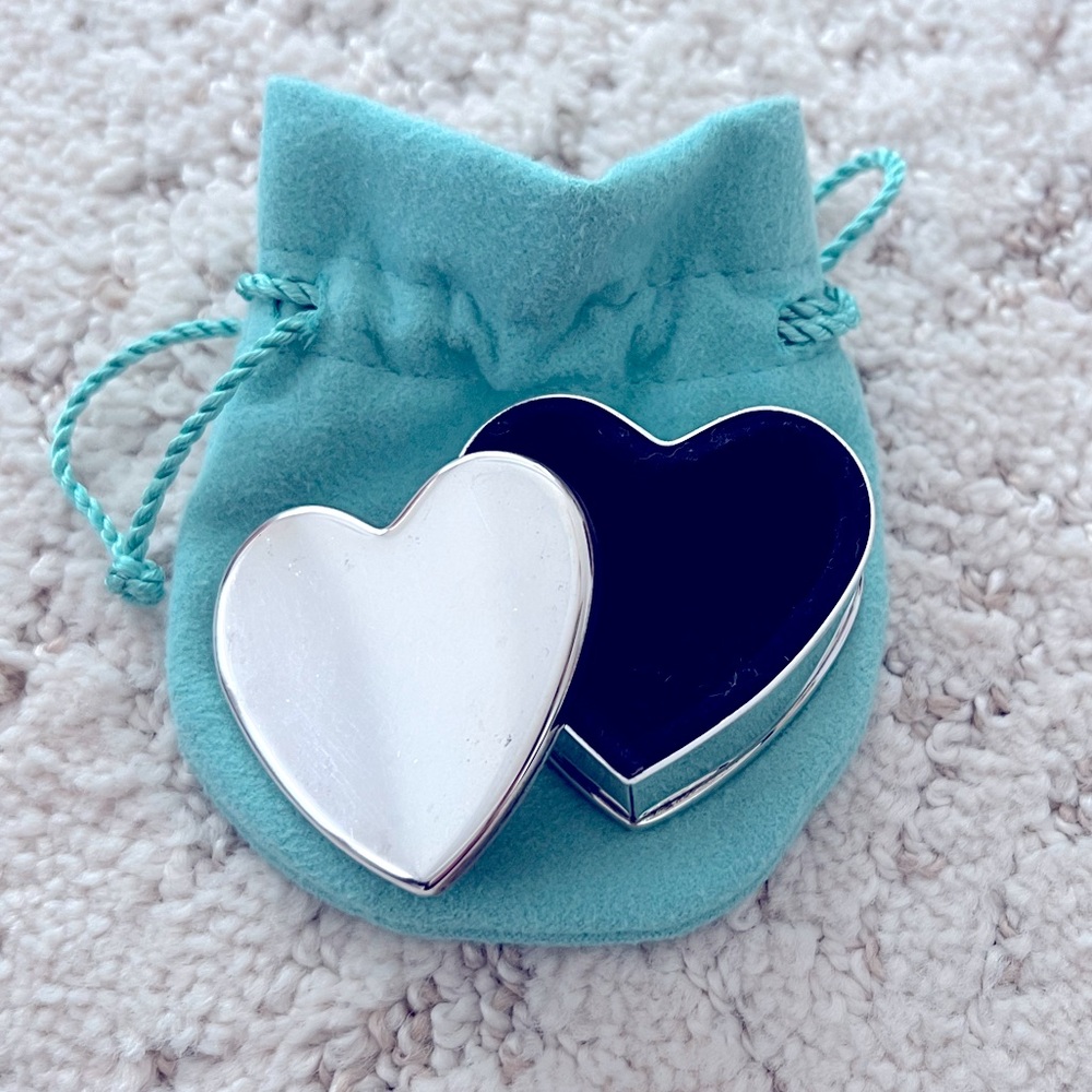 Tiffany & Co. Small heart shaped box. Silver with soft velvet interior.